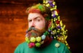 Merry Christmas and Happy New year. Serious bearded man with decorated beard for Christmas or New year party. Christmas Royalty Free Stock Photo