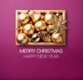 Merry Christmas and happy new year.Shiny gold Christmas decoration ball and star with golden frame in purple luxury background. Royalty Free Stock Photo