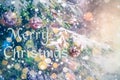 Merry Christmas! Happy New Year 2021. Snowflakes blurred background. Christmas tree in forest decorated with silver balls and Royalty Free Stock Photo