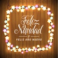Merry Christmas and Happy New Year. Spanish Language. Glowing Lights Wreath for Xmas Holiday Greeting Card Design. Wooden Hand Dr Royalty Free Stock Photo