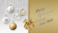 Merry Christmas and happy new year text with gold shiny ribbon bow, decorative glitter tree balls hanging on bokeh lights and snow Royalty Free Stock Photo