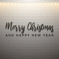 Merry Christmas and Happy New Year text with christmas light on white brick background