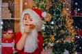 Merry Christmas and happy new year. Thanksgiving day and Christmas. Happy Santa Claus - cute boy child eating a cookie Royalty Free Stock Photo
