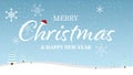 Merry Christmas and Happy New Year typographical on blue background with winter landscape with snowflakes. Royalty Free Stock Photo