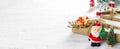 Merry Christmas and Happy new year web banner. Santa Clause toys with Natural Christmas gift box with pine tree and Christmas toys