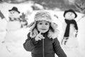 Merry Christmas and Happy new year. Winter portrait of little boy child in snow Garden make snowman. Cute kid - winter Royalty Free Stock Photo