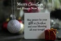Merry Christmas and Happy New Year wishes with message - May peace be your gift at Christmas and your blessing all year trough. Royalty Free Stock Photo