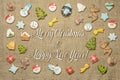 Merry Christmas and Happy New Year! written among gingerbread cookies. Royalty Free Stock Photo