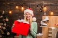 Merry Christmas and Happy New Year. Young woman with christmas present boxes in front of christmas tree. Home Holiday Royalty Free Stock Photo