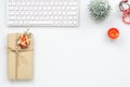 Merry Christmas and Happy new years office work space desktop concept. Flat lay top view with keyboard, natural gift box and Royalty Free Stock Photo