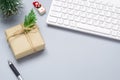 Merry Christmas and Happy new years office work space desktop concept. Flat lay top view with keyboard, natural gift box and Royalty Free Stock Photo