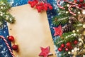 Merry Christmas holiday card or banner with snowy fir branches, cones and festive decorations. Magic bokeh lights