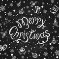 Merry Christmas with holiday decorations on black chalkboard background