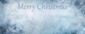 Merry Christmas inscription on cracked ice blue colored surface with copy space Royalty Free Stock Photo