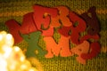 Merry Christmas felt letters on knitted background