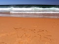 Merry Christmas lettering on the beach. Royalty Free Stock Photo