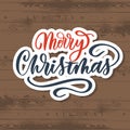 Merry Christmas lettering label on wood background Vector Royalty Free Stock Photo