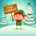 Merry Christmas! Little elf holds wooden board sign in Christmas Royalty Free Stock Photo