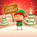 Merry Christmas! Little elf holds wooden board sign in Christmas snow scene winter landscape Royalty Free Stock Photo