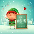 Merry Christmas! Little elf with message board in Christmas snow Royalty Free Stock Photo