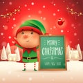 Merry Christmas! Little elf with message board in Christmas snow scene winter landscape Royalty Free Stock Photo