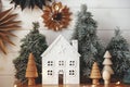 Merry Christmas! Christmas little house, trees, lights, paper stars. Magic winter village scene Royalty Free Stock Photo