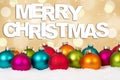 Merry Christmas many colorful balls golden background with snow Royalty Free Stock Photo