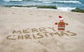 Christmas starfish with greeting on beach Royalty Free Stock Photo