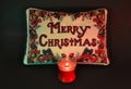 Merry Christmas Message with Red Candle Black Bkgrnd