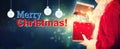 Merry Christmas message with Santa opening a gift box Royalty Free Stock Photo