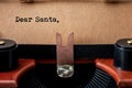 Merry Christmas, Old Fashioned Wish List And Sending A Letter To Santa Claus Conceptual Idea With Close Up On Vintage Typewriter