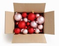 Merry christmas, open cardboard box full of red pink xmas balls, top view isolated on white background, for promotional and Royalty Free Stock Photo