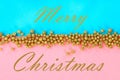 Merry Christmas. Pastel background decorated with shiny decorative stars and balls.