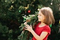 Merry Christmas. Portrait of happy funny child girls in Santa hat with Christmas wreath Royalty Free Stock Photo