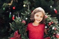 Merry Christmas. Portrait of happy funny child girls in Santa hat with Christmas wreath Royalty Free Stock Photo