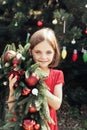 Merry Christmas. Portrait of happy funny child girls in Santa hat with Christmas wreath Royalty Free Stock Photo