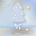 Merry Christmas postcard with Christmas tree gold baby blue on a light blue bokeh background.