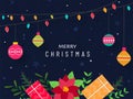 Merry Christmas Poster Design with Gift Boxes, Poinsettia flower, Colorful Lighting Garland Baubles on Blue Background Royalty Free Stock Photo