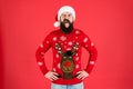 Merry christmas. ready for xmas party. happy new year. winking hipster funny knitted sweater. warm clothes in cold Royalty Free Stock Photo