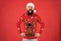 Merry christmas. ready for xmas party. happy new year. winking hipster funny knitted sweater. warm clothes in cold Royalty Free Stock Photo