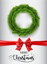 Merry Christmas realistic wreath isolate on white background with red ribbon and text. Vector illustration.