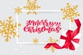 Merry Christmas red vintage calligraphy lettering vector text on greeting Christmas card with golden snowflakes and gift Royalty Free Stock Photo