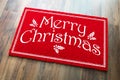 Merry Christmas Red Welcome Mat On Wood Floor Background Royalty Free Stock Photo
