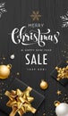 Merry Christmas sale gift box golden ribbon, white color concept design on black wood background Royalty Free Stock Photo