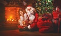 Merry Christmas! santa claus and child girl at night at the Chr Royalty Free Stock Photo