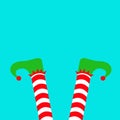 Merry Christmas. Santa Claus Elf legs with green shoes. Upside down. Red white striped socks. Happy New Year. Cute cartoon funny Royalty Free Stock Photo