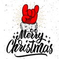 Merry christmas. Santa Claus hand with rock and roll sign. Royalty Free Stock Photo