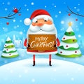 Merry Christmas! Santa Claus holds wooden board sign in Christmas snow scene winter landscape Royalty Free Stock Photo