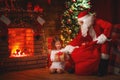 Merry Christmas! santa claus and child girl at night at the Chr Royalty Free Stock Photo