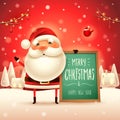 Merry Christmas! Santa Claus with message board in Christmas snow scene landscape